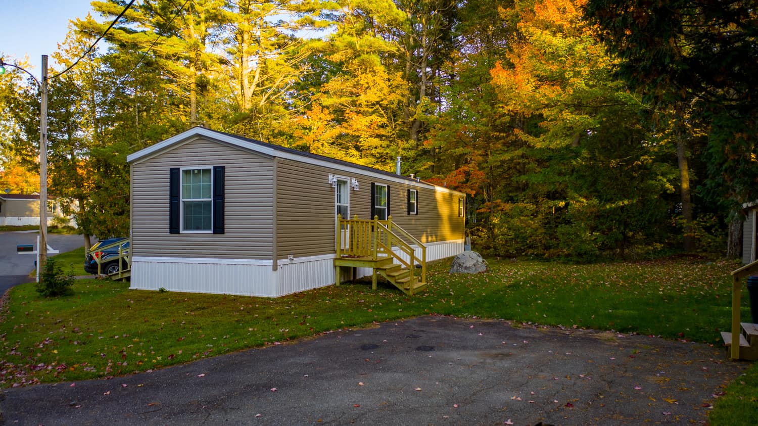 A tidy manufactured home with a private deck